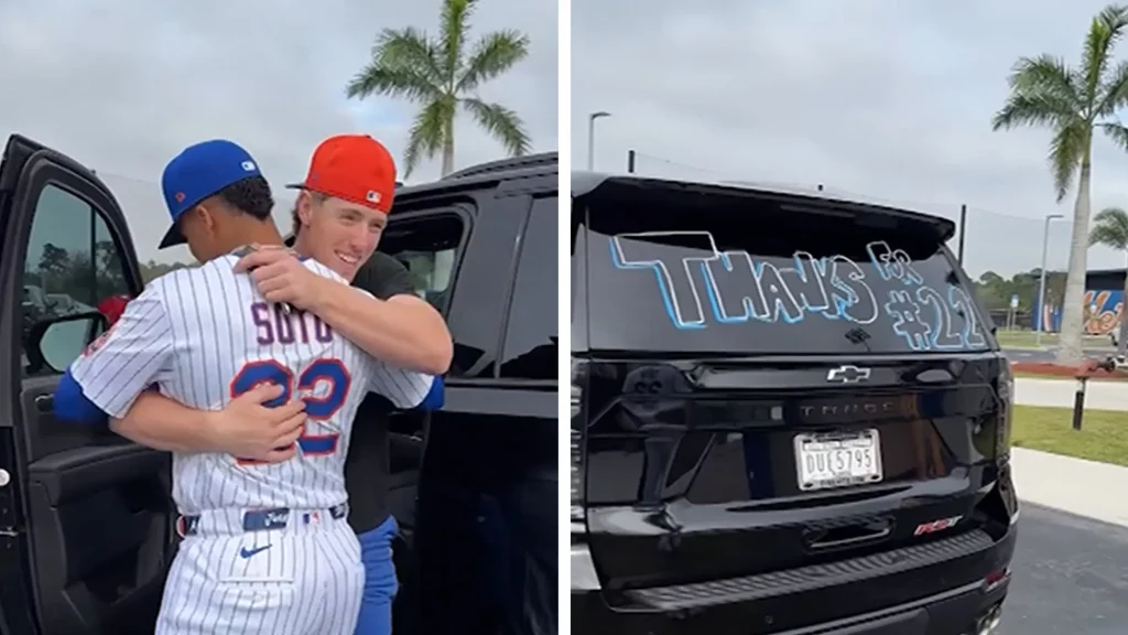 Juan Soto handing car keys to Brett Baty in front of a black SUV with a red bow.